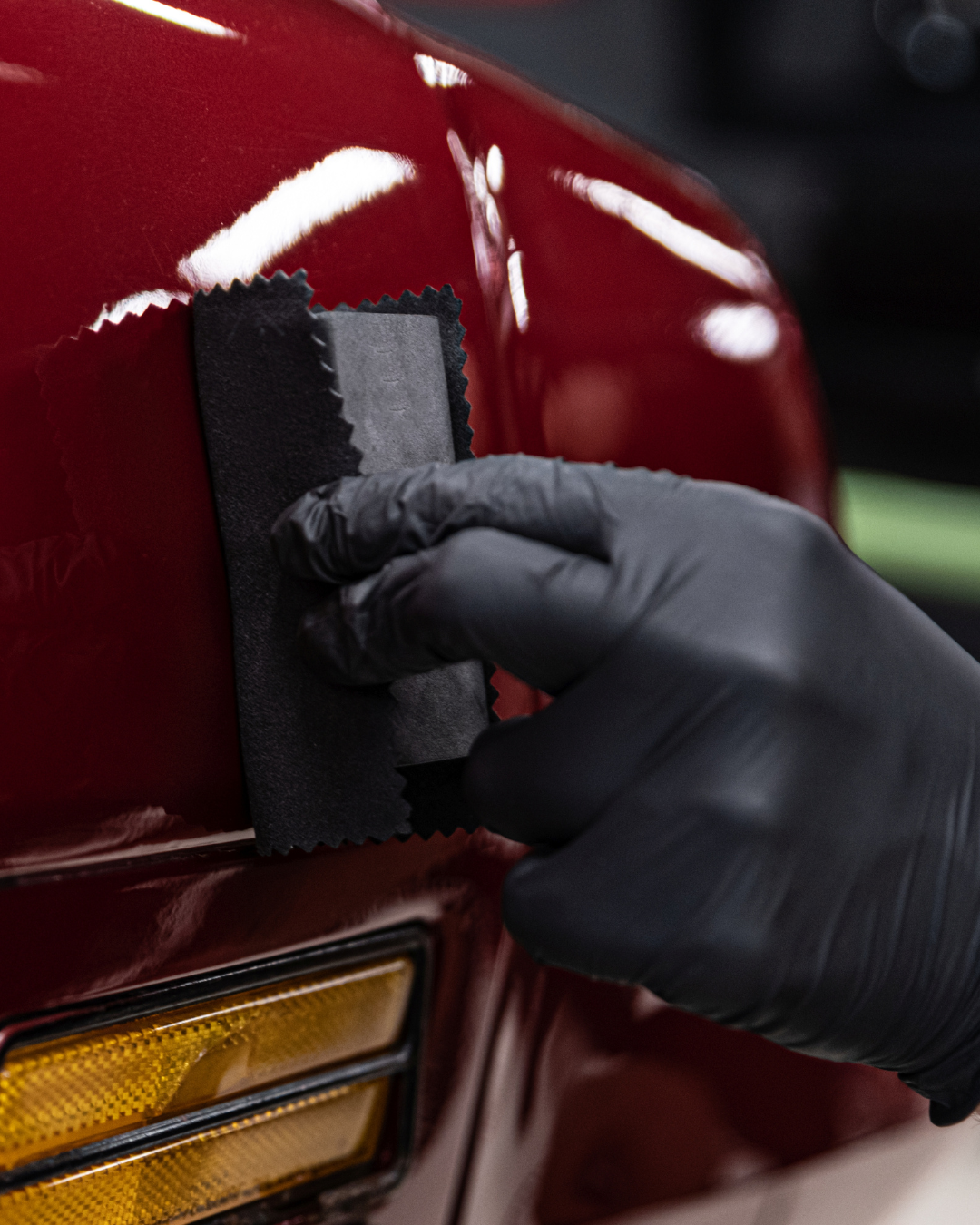 Clear coat finish on red car